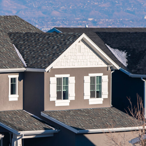 Square Beautiful grey houses against mountain background day light