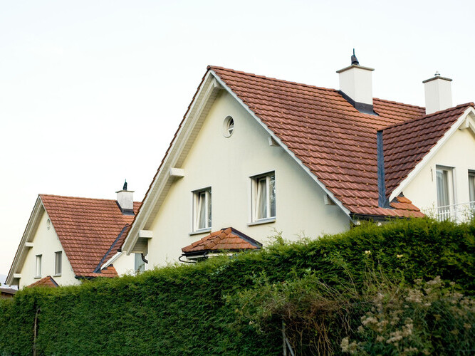 An image of a beautiful house with tile roof